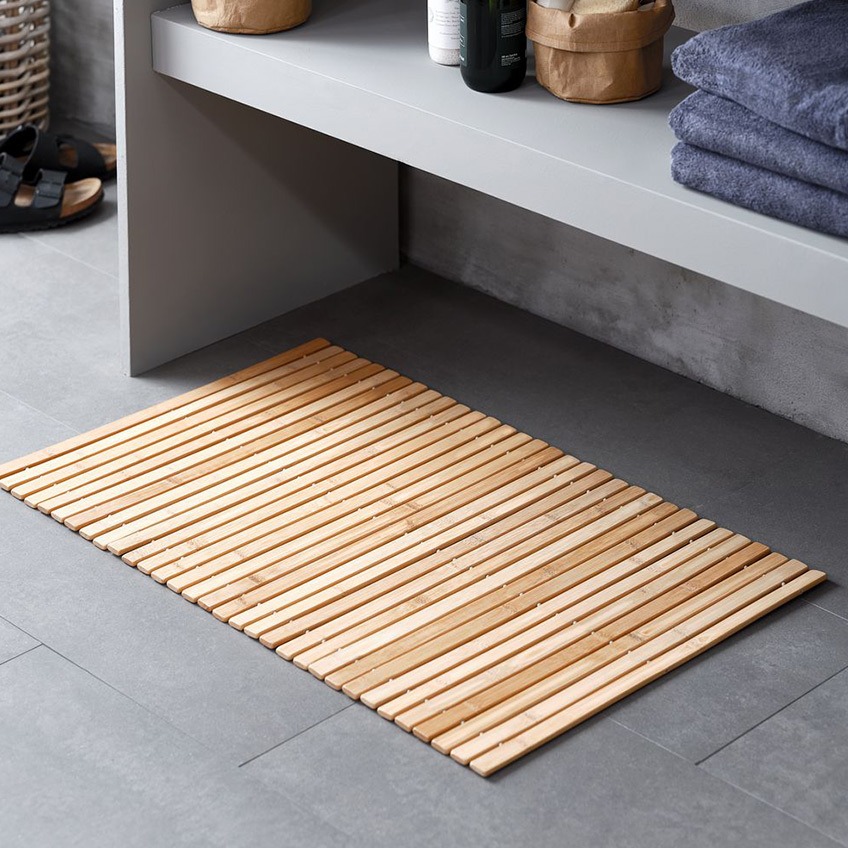 bath mat in wood on a bathroom floor