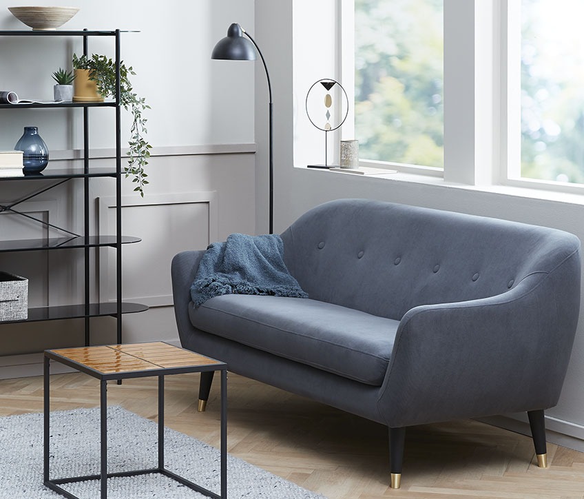 Living room with a EGEDAL 2,5 seater sofa and HARSTAD end table A living room with a small sofa that leaves space for an armchair for reading