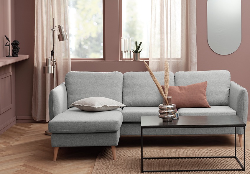 Light grey sofa with chaise longue on the left-hand side